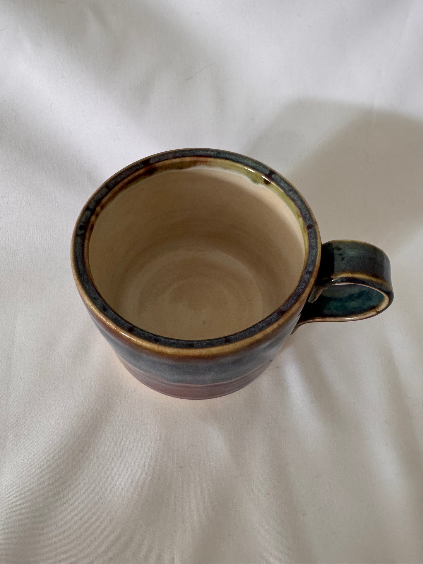 A mug (purple-blue outside, white inside)