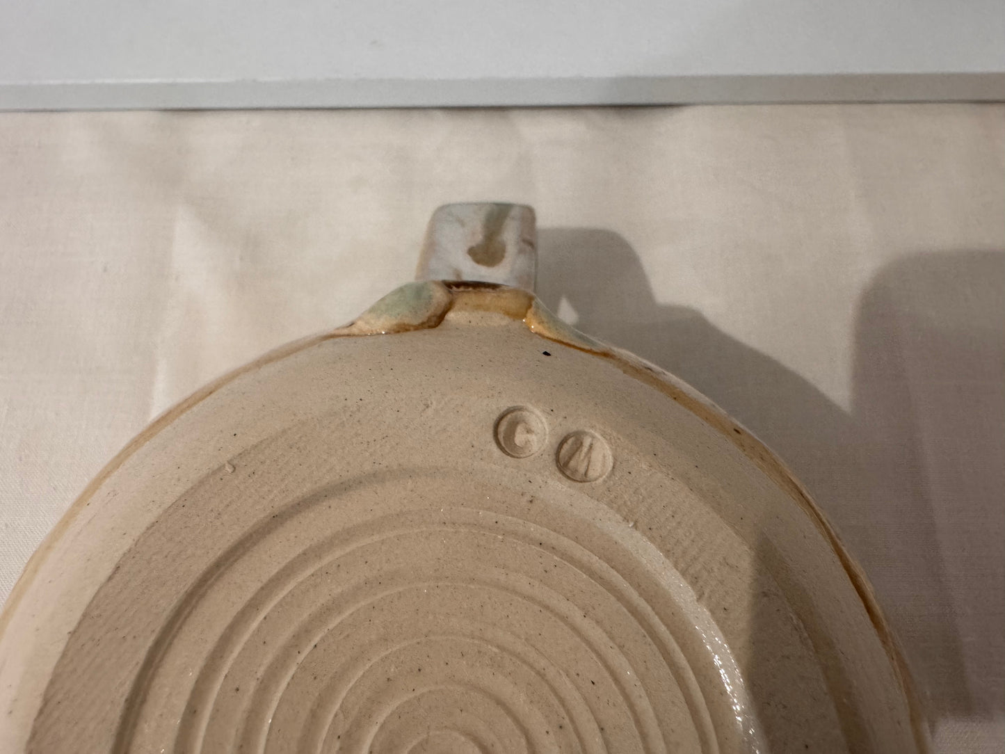 A mug (greens/ creams)