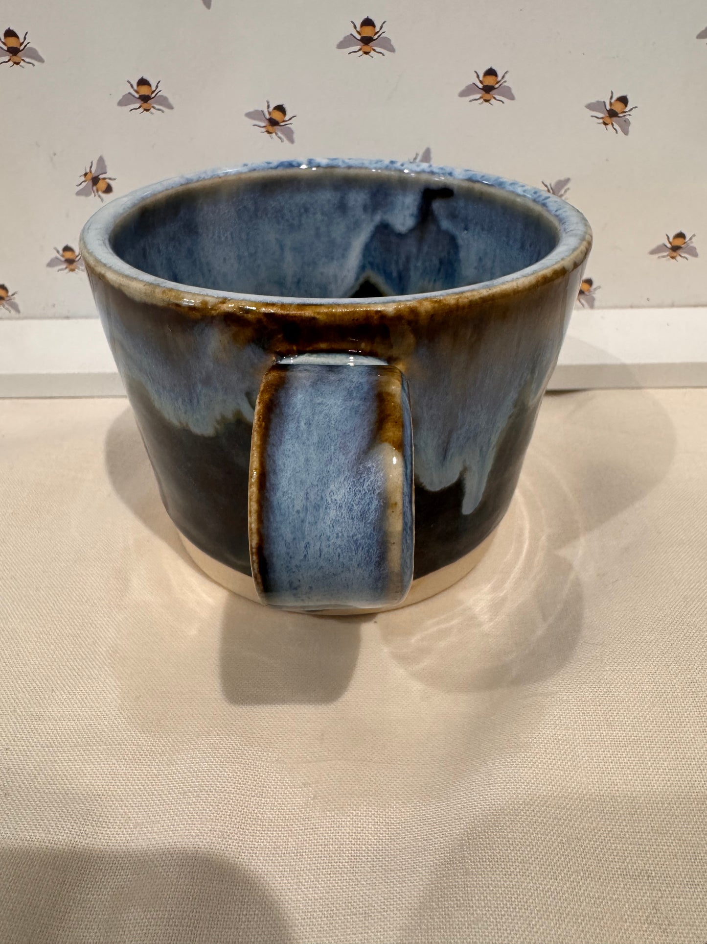 A tea mug (blues/ browns)