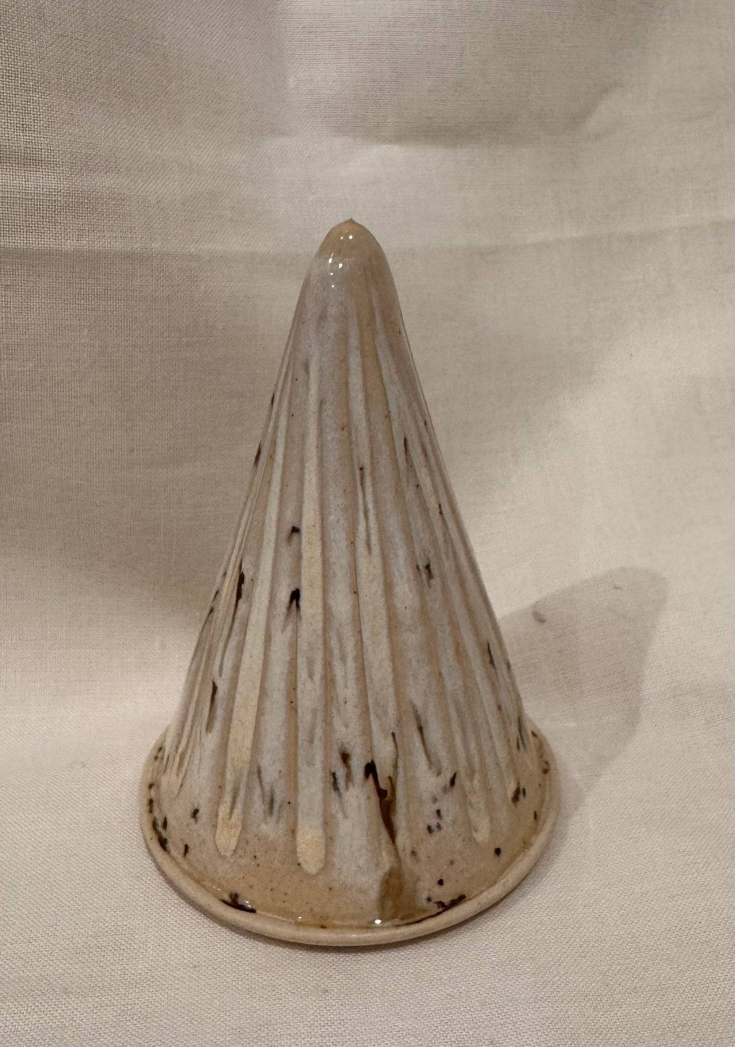 A Christmas tree ornament (cream/ flecks, fluted)