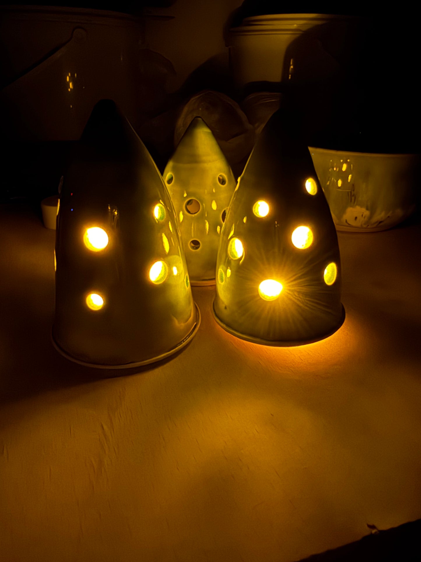 A christmas tree ornament (green, holes)