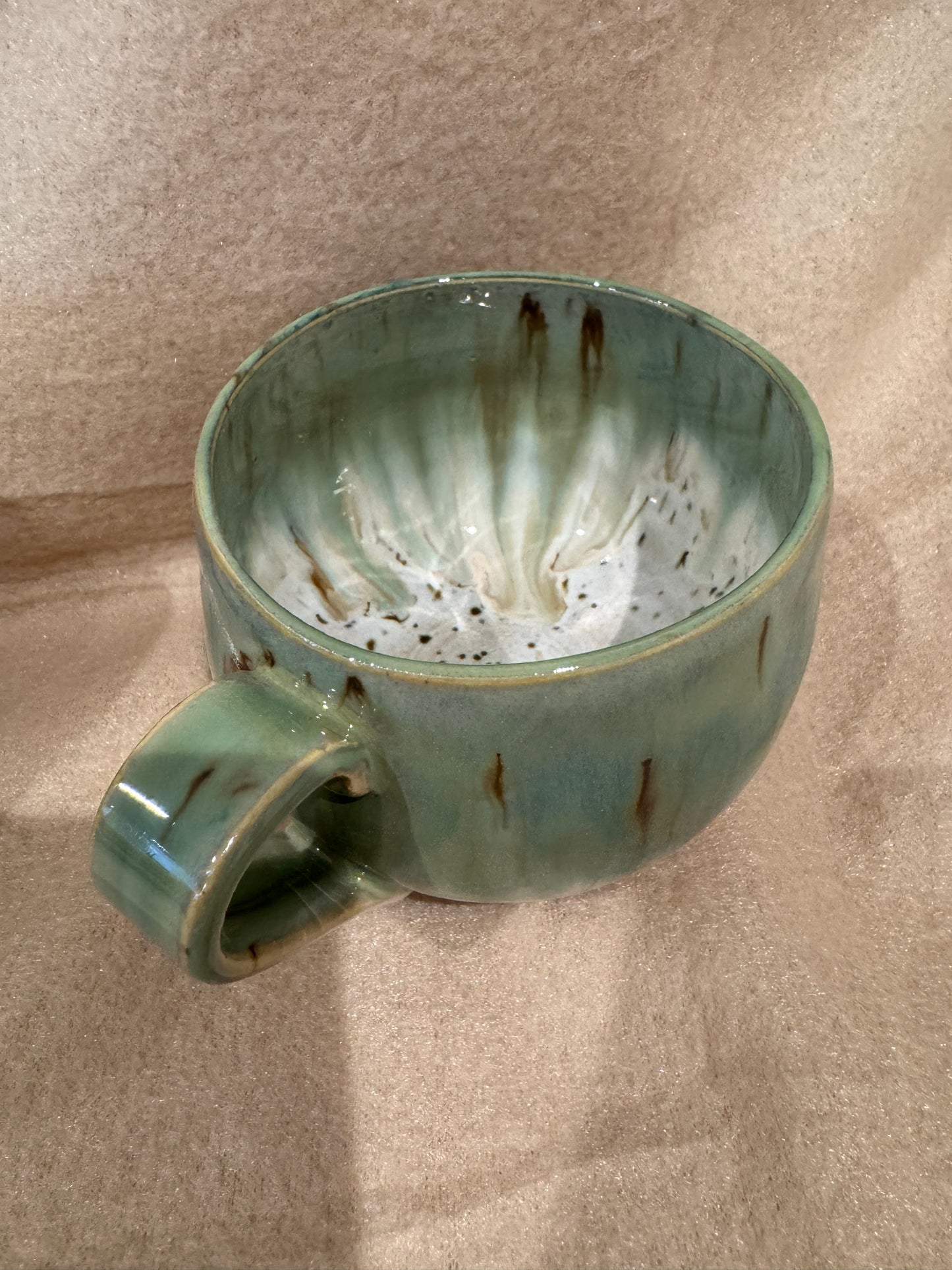 A rounded bottom mug (greens/ creams)