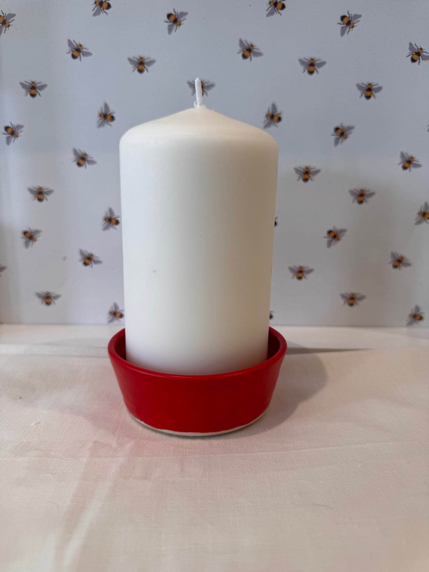 Candle dish (bold red) with large candle