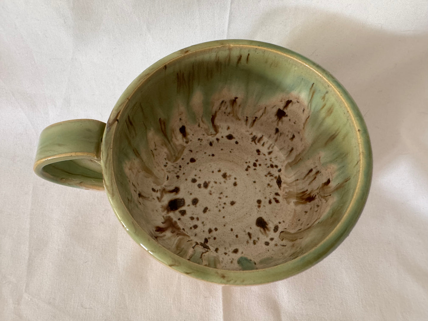 A rounded bottom mug (greens/ creams)