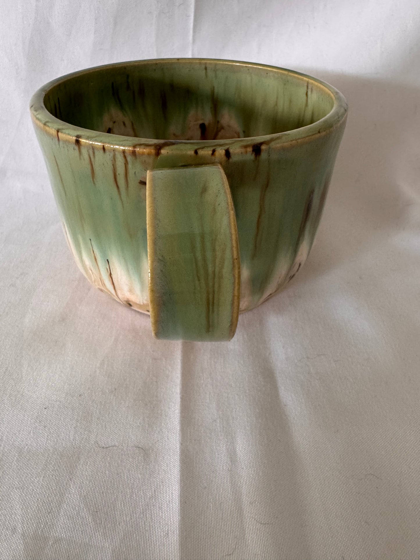 A rounded bottom mug (greens/ creams)