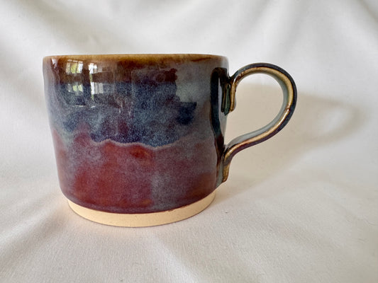A mug (purple-blue outside, white inside)