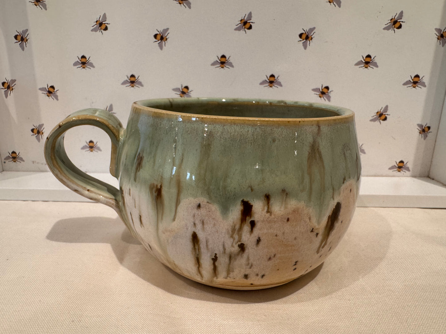 A mug (greens/ creams)