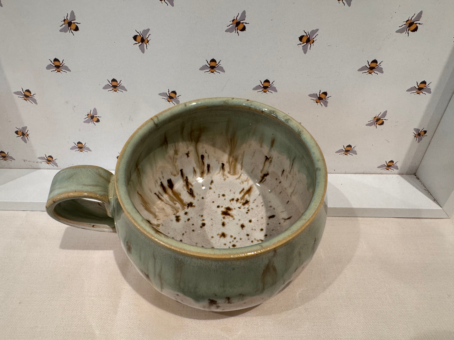 A mug (greens/ creams)