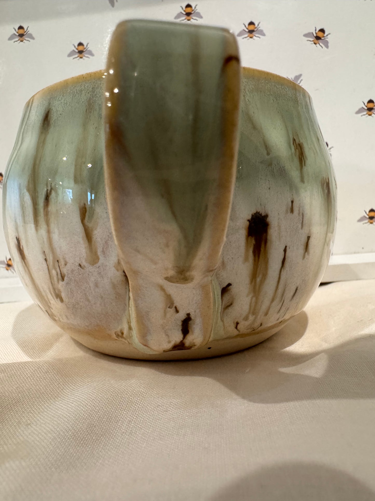 A mug (greens/ creams)