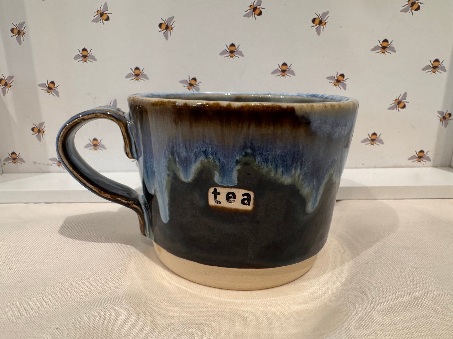 A tea mug (blues/ browns)