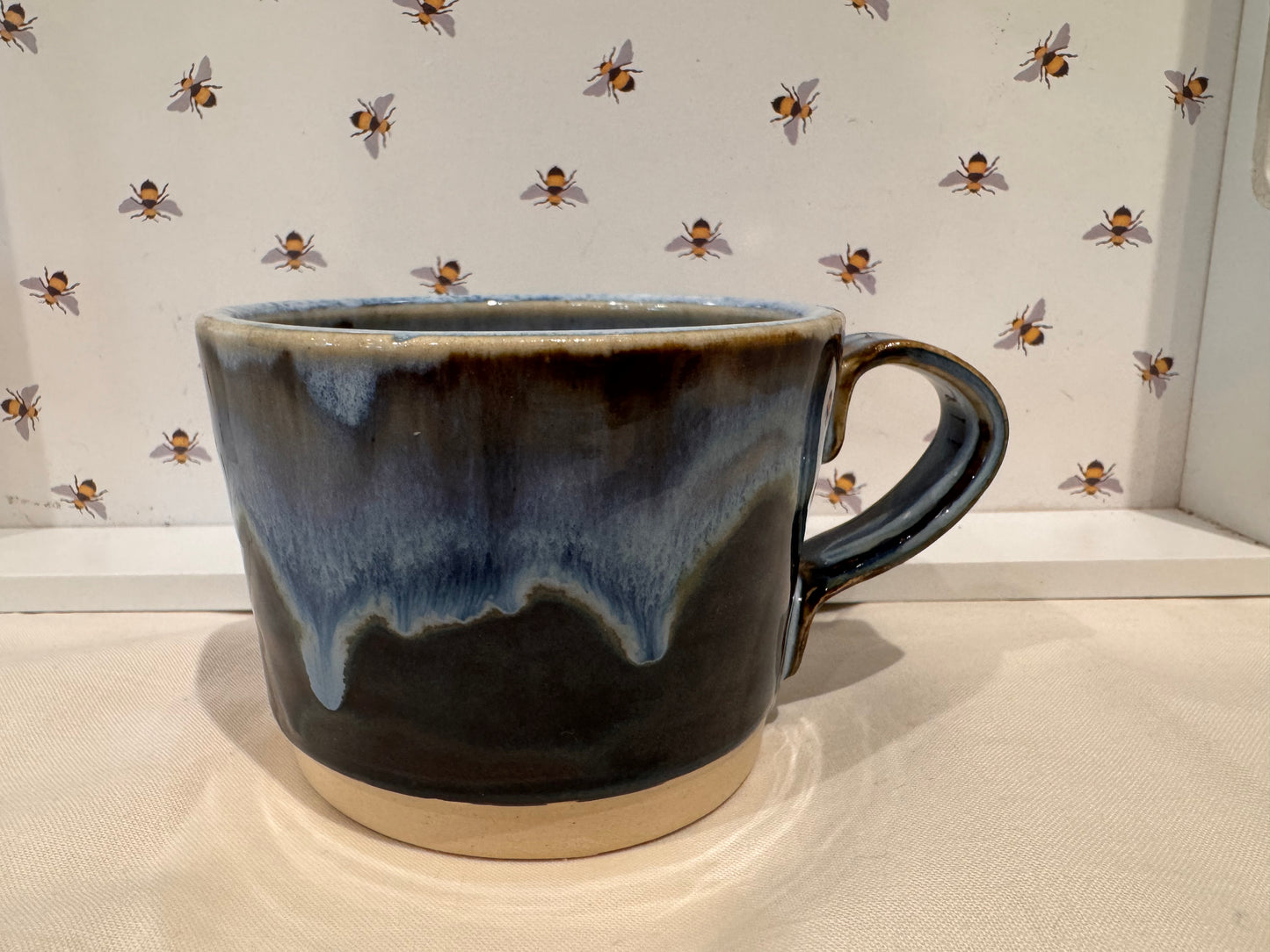 A tea mug (blues/ browns)