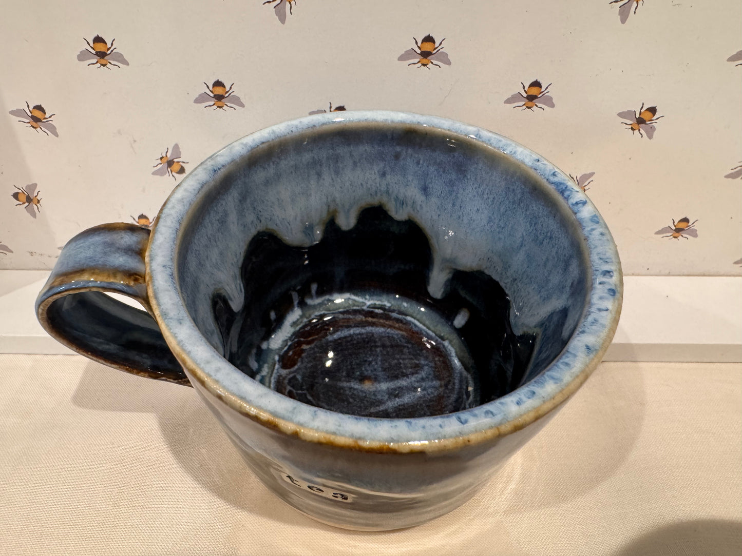 A tea mug (blues/ browns)