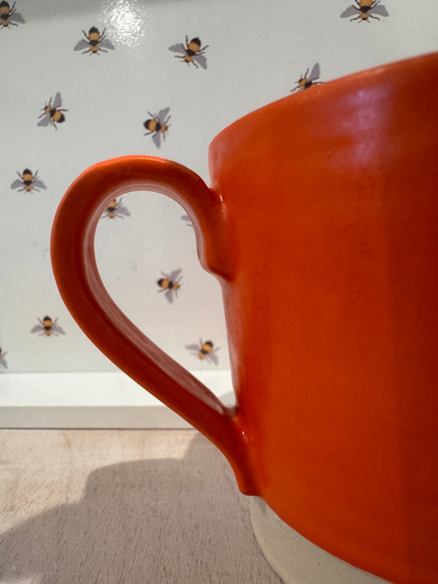 A  mug (bright orange)
