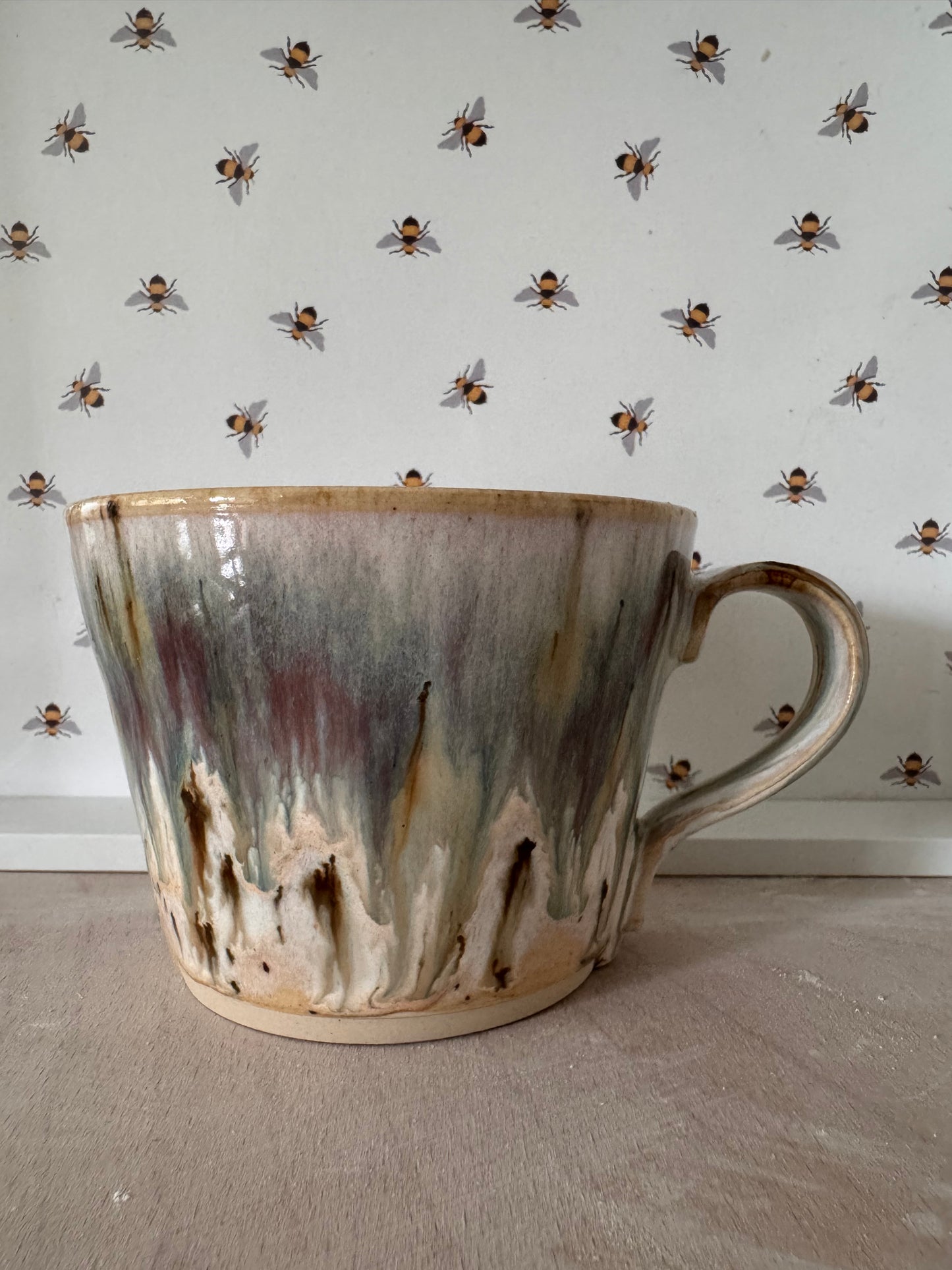 A mug (cream with bluey-purples)