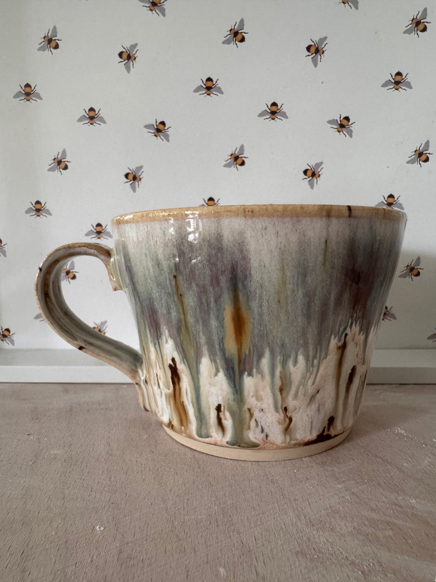 A mug (cream with bluey-purples)