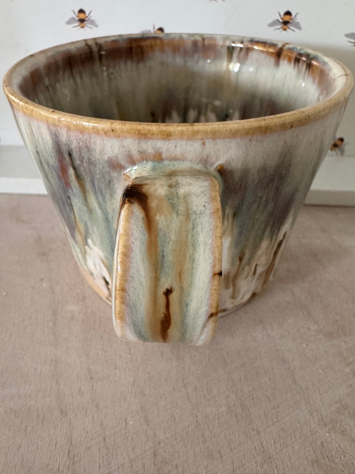 A mug (cream with bluey-purples)