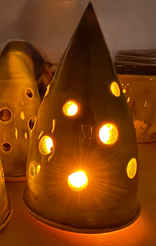 A christmas tree ornament (green, holes)