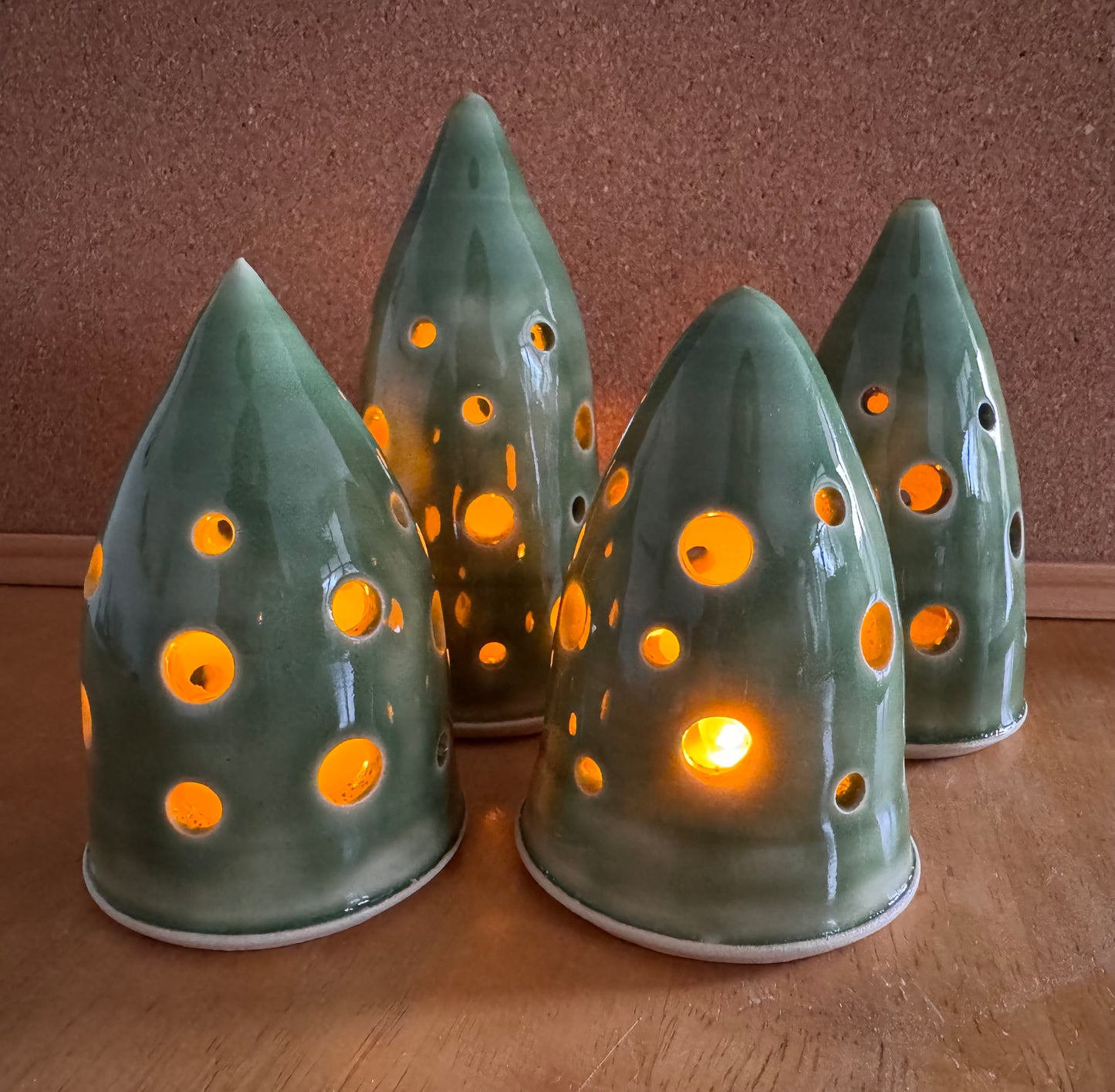 A christmas tree ornament (green, holes)
