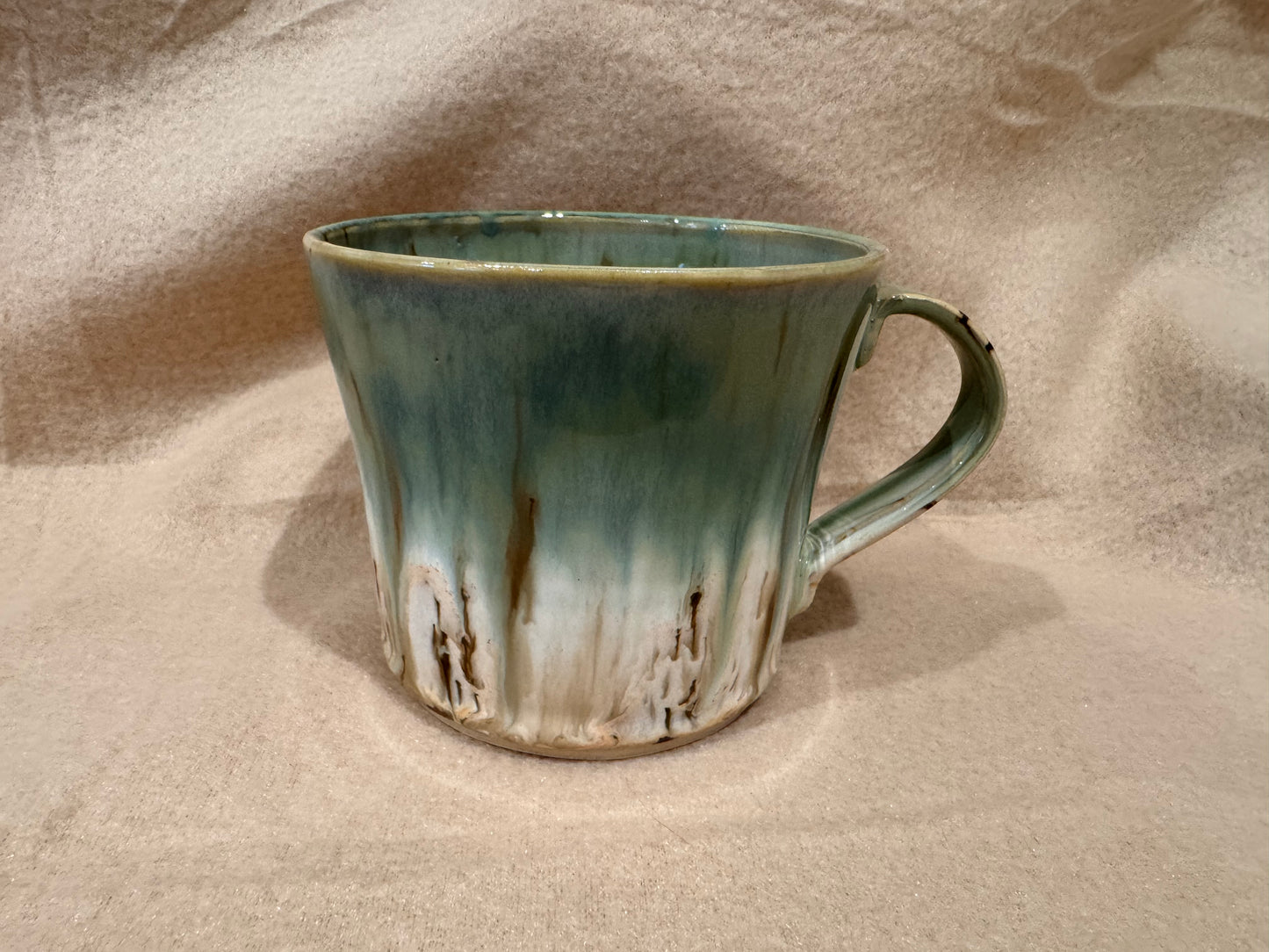 A mug (cream with greens)