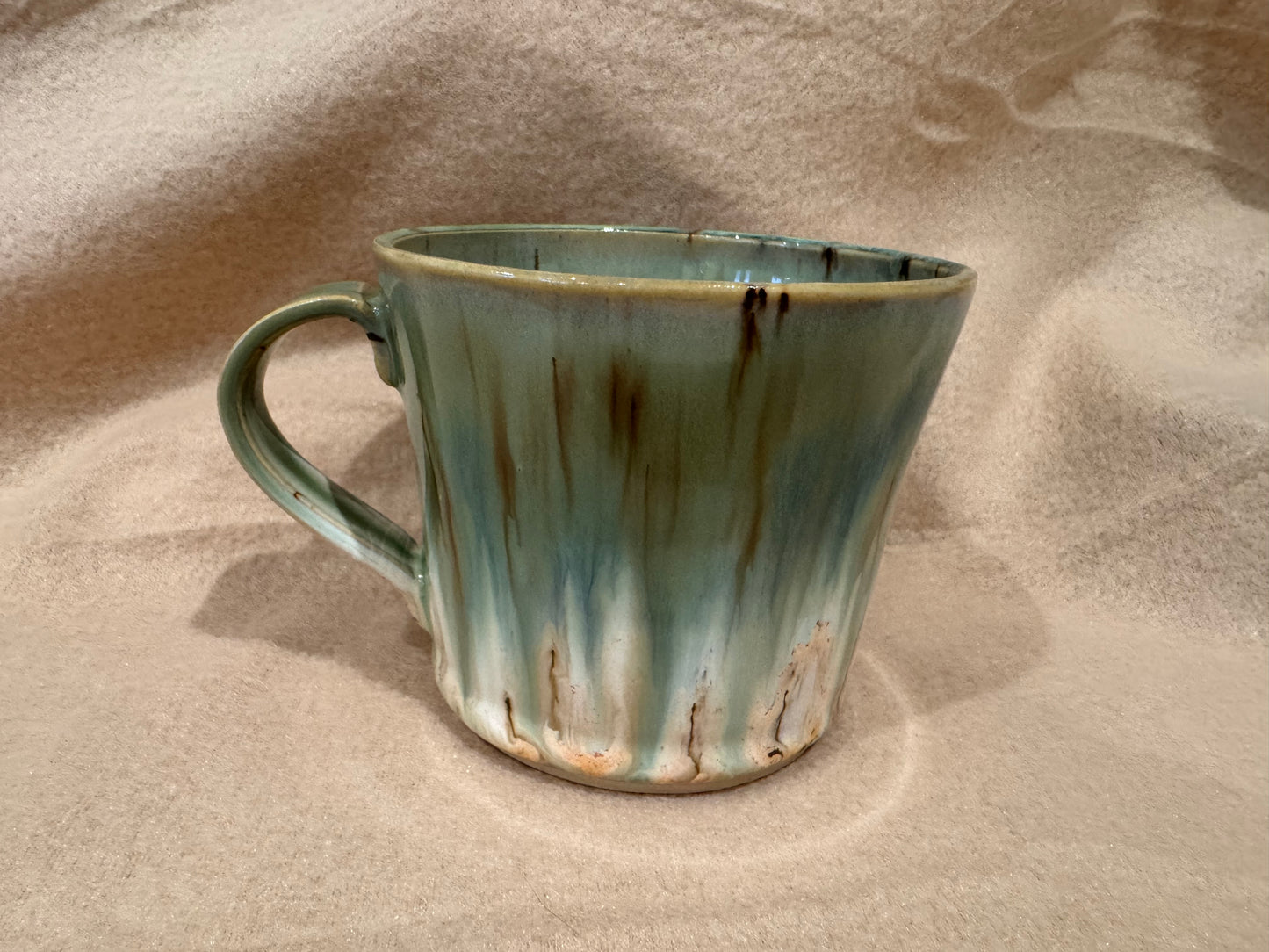 A mug (cream with greens)