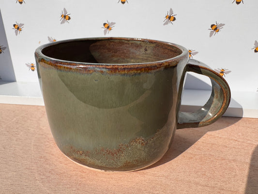 Hand thrown cup in mossy green